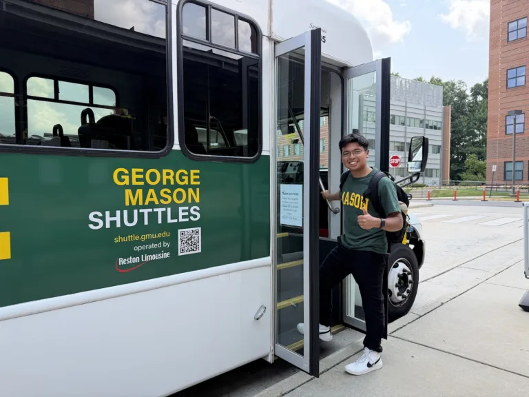 A George Mason student boarding the Mason Shuttle